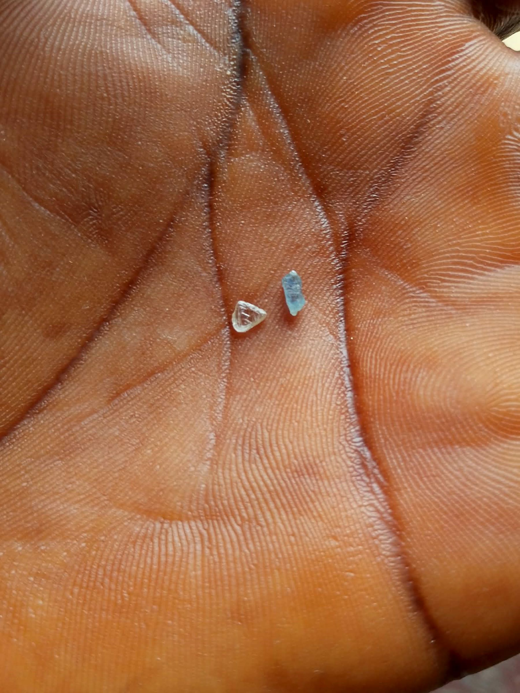 Two small diamond pieces recovered from the Tiaplay Mining Zone along the Zlan River